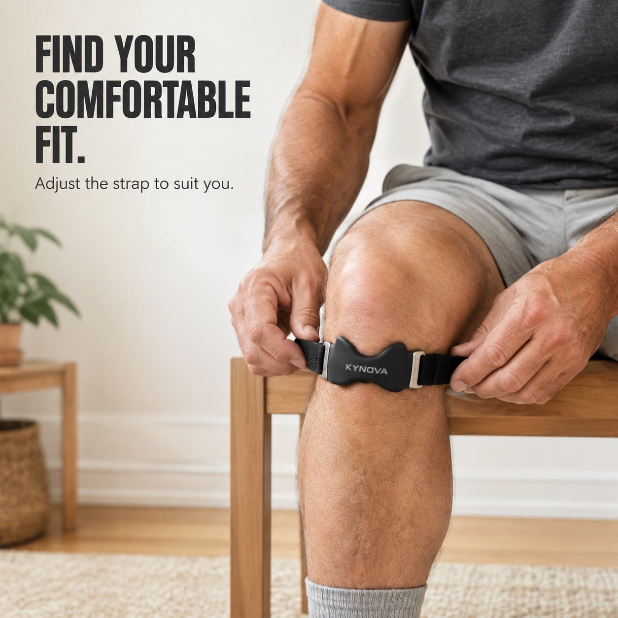 Seated man adjusting the sides of Kynova immediately below the kneecap